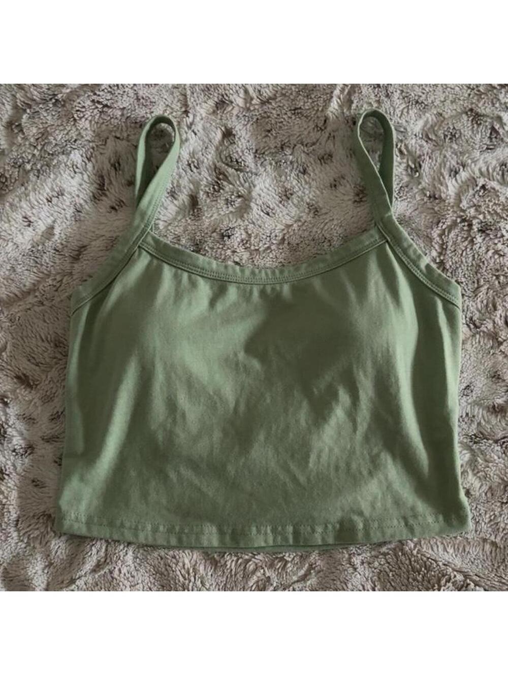 sage green crop top with criss-cross back design and built-in bra